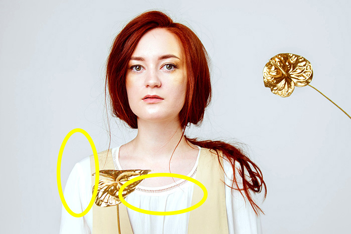 一个女性模型的演播室画象与在黄色盘旋的亮点的